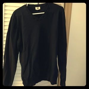 Navy blue v-neck sweater.